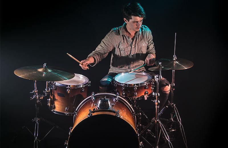 Making music on the drums. - JAZZ ROCKERS